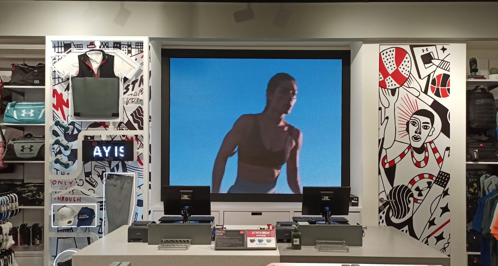 Indoor LED screen installation at Under Armour retail store in Jakarta, Indonesia, showcasing high-resolution sports visuals as part of the 2025 digital display upgrade.